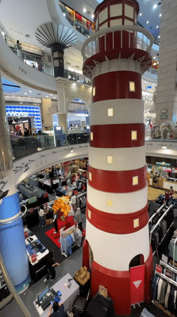 Bangkok mall features lighthouse decoration among clothing displays