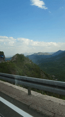 Mountain scenery captured from vehicle in Montenegro countryside