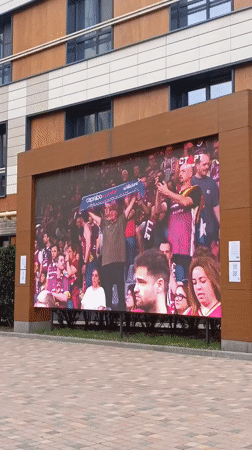 Moscow public square hosts outdoor basketball viewing with seating area