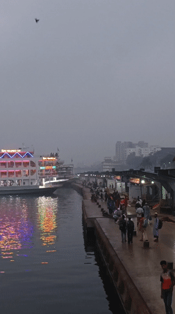 Ferry passengers disembark in foggy Dhaka terminal