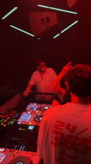 DJ performs at packed Patong nightclub under red lights