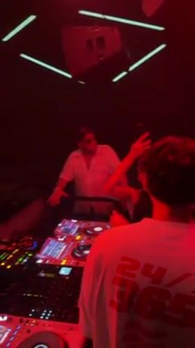 DJ performs at packed Patong nightclub under red lights