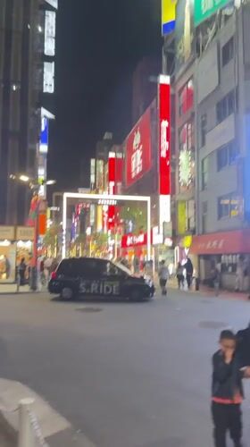 Nighttime pedestrian crossings documented at busy Shinjuku intersection