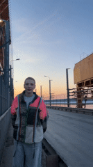 Woman photographed taking selfies on bridge in Chaikovsky, Russia