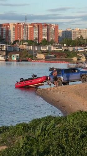 Family waterside recreation documented in Khabarovsk, Russia