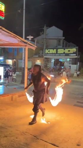 Fire performers and fireworks light up Phu Thuy Ward at night