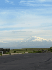 Snow-covered Mount Ararat viewed from Yerevan through hazy skies