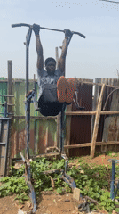 Man exercises on homemade fitness equipment in Akwanga