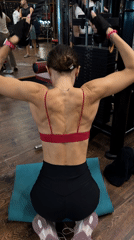 Woman completes late-night gym workout in Ubud, Indonesia