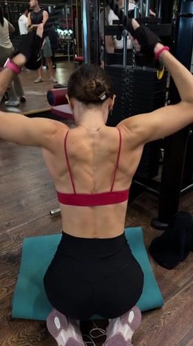 Woman completes late-night gym workout in Ubud, Indonesia