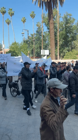 Demonstrators march with Arabic banners in Marrakesh