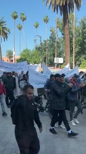 Demonstrators march with Arabic banners in Marrakesh