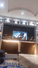 Living room TV plays through a run of music videos