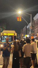 Large street crowd gathers around Tesla in NYC