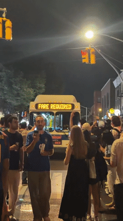 Large street crowd gathers around Tesla in NYC