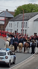Historical military parade with mounted riders in Belgian town
