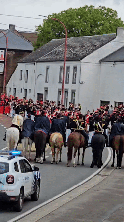 Historical military parade with mounted riders in Belgian town