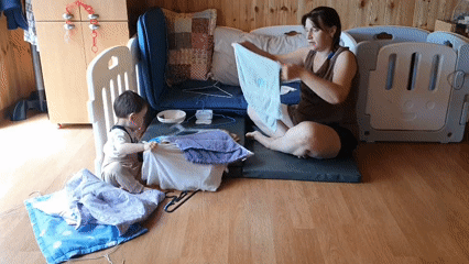 Mother and toddler share quiet moments in wooden room