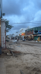 Sand-covered street with destroyed building observed in Vietnam