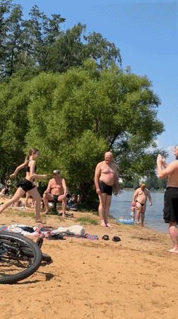Summer beach day unfolds at Malakhovka lake, Russia