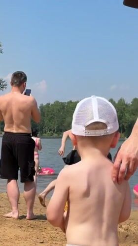 Summer beach day unfolds at Malakhovka lake, Russia