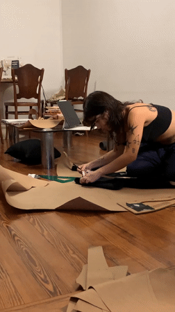 Person drafts patterns on floor in Buenos Aires midnight session