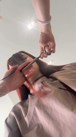 Woman documents hair salon visit in Mozhga, Russia