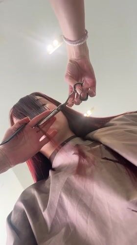 Woman documents hair salon visit in Mozhga, Russia