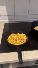 Egg scramble cooking documented in Barcelona kitchen
