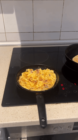Egg scramble cooking documented in Barcelona kitchen
