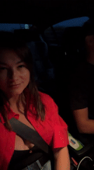 Woman photographed smiling in car passenger seat in Prijevor