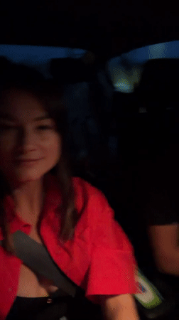 Woman photographed smiling in car passenger seat in Prijevor