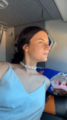 Woman in decorated attire observed in vehicle, Vietnam