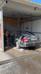 Audi getting pressure-washed at outdoor self-service car wash in Karnobat