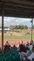 Crowd gathers on stadium field in Lagos