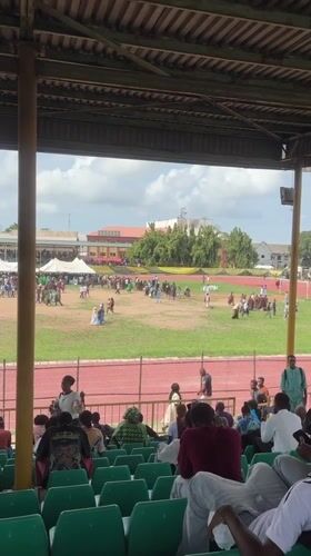 Crowd gathers on stadium field in Lagos
