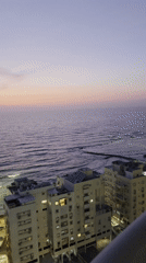 Ocean view captured at dusk from building in Bat Yam