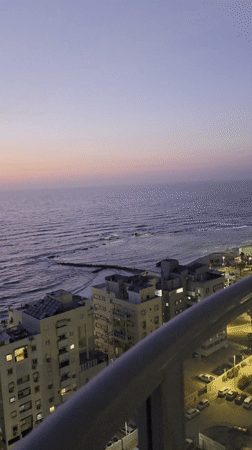 Ocean view captured at dusk from building in Bat Yam