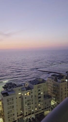 Ocean view captured at dusk from building in Bat Yam