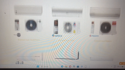 Person browses air conditioner catalog online in Pernik, Bulgaria