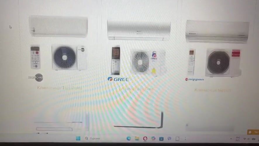 Person browses air conditioner catalog online in Pernik, Bulgaria