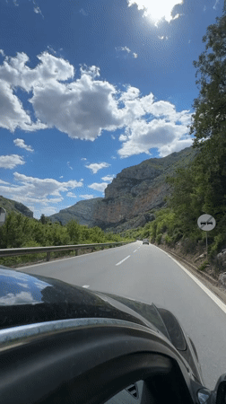Toyota Land Cruiser travels mountain road near Donje Mrke, Montenegro