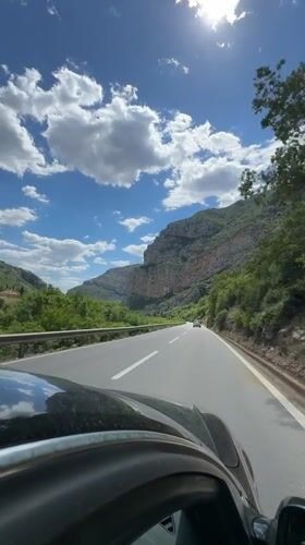 Toyota Land Cruiser travels mountain road near Donje Mrke, Montenegro
