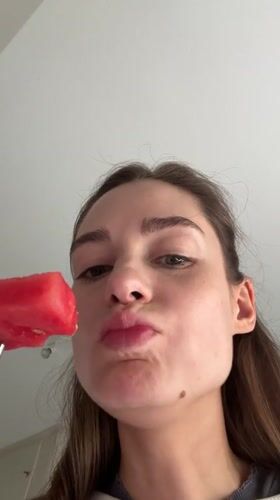 Woman enjoys watermelon breakfast in Kiel, Germany
