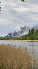 Quiet afternoon boating and relaxation captured at Latvian lake