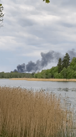 Quiet afternoon boating and relaxation captured at Latvian lake