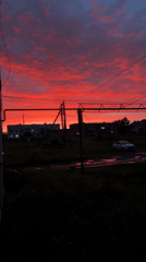Vivid midsummer sunset lights up the sky over Mursalimkino