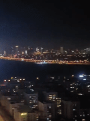 Dubai skyline captured in nighttime panoramic footage from high-rise