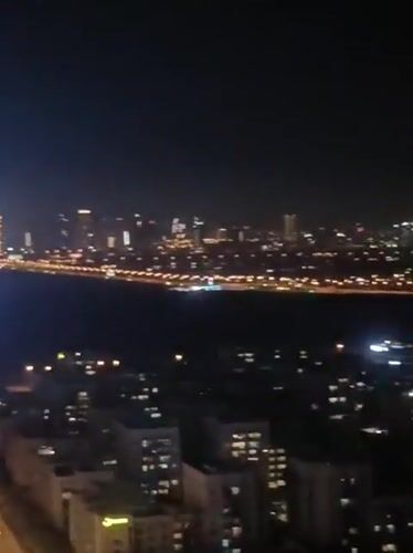 Dubai skyline captured in nighttime panoramic footage from high-rise