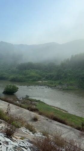 Misty riverbank stop in Nam Khanh Vinh, Vietnam
